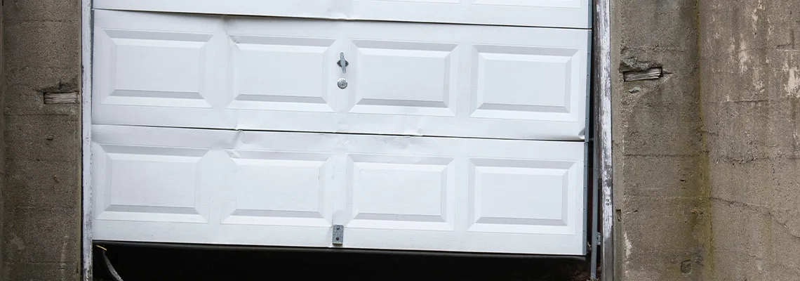 Garage Door Got Hit By A Car Dent Removal in DeKalb, IL